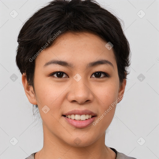 Joyful asian young-adult female with short  brown hair and brown eyes