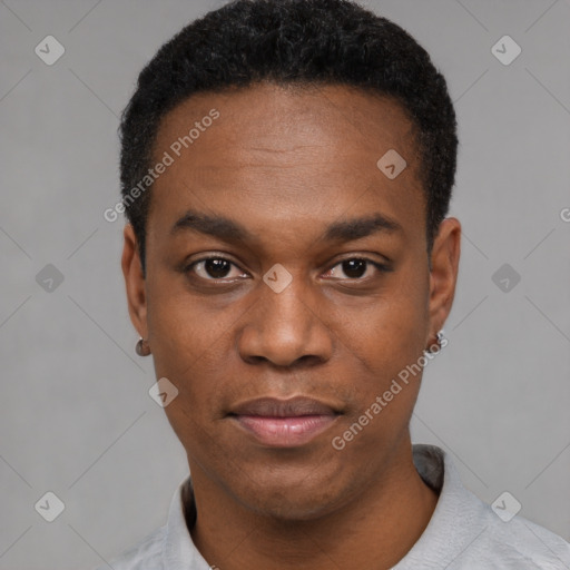 Joyful black young-adult male with short  black hair and brown eyes