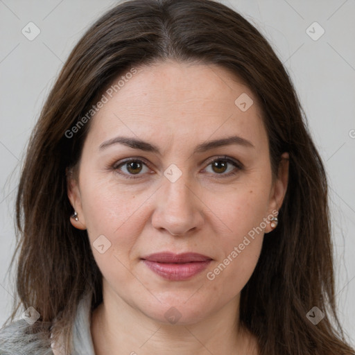 Joyful white adult female with long  brown hair and brown eyes