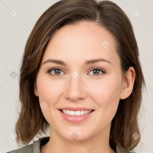 Joyful white young-adult female with medium  brown hair and green eyes