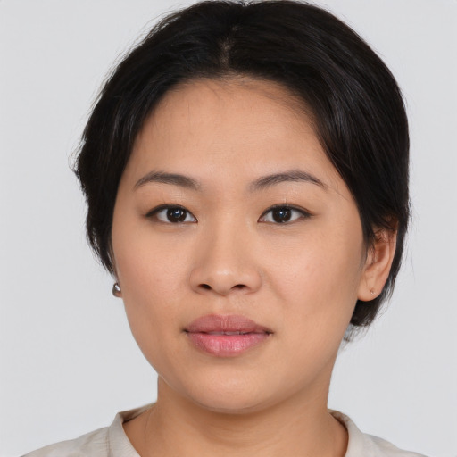 Neutral asian young-adult female with medium  black hair and brown eyes