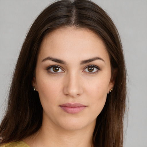 Neutral white young-adult female with long  brown hair and brown eyes