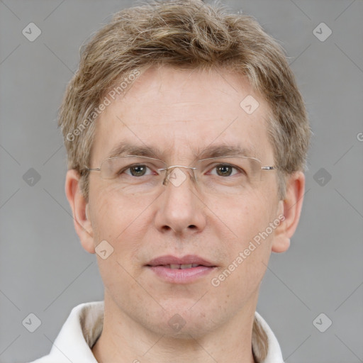 Joyful white adult male with short  brown hair and grey eyes