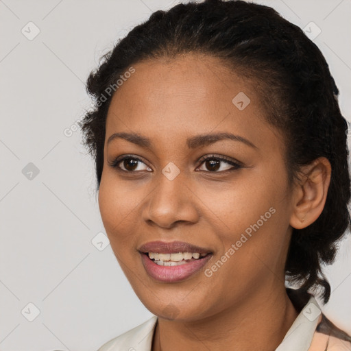 Joyful black young-adult female with medium  brown hair and brown eyes