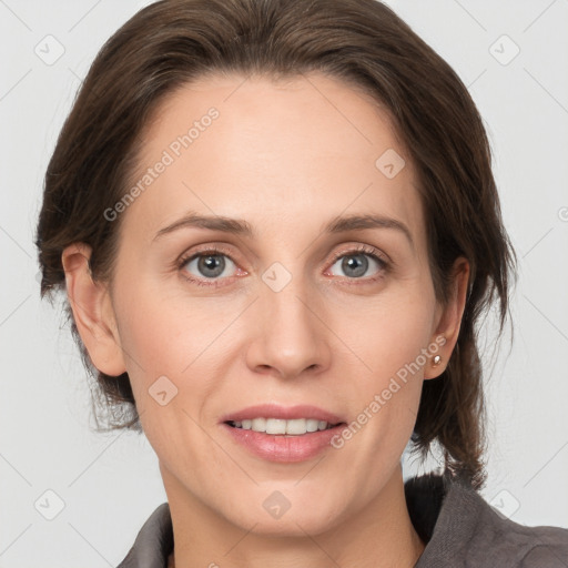 Joyful white adult female with medium  brown hair and grey eyes