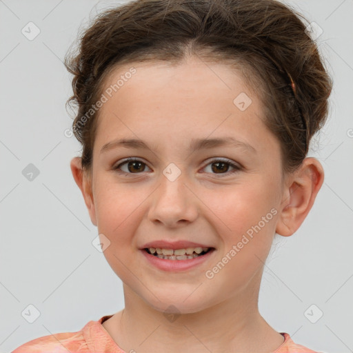 Joyful white child female with short  brown hair and brown eyes