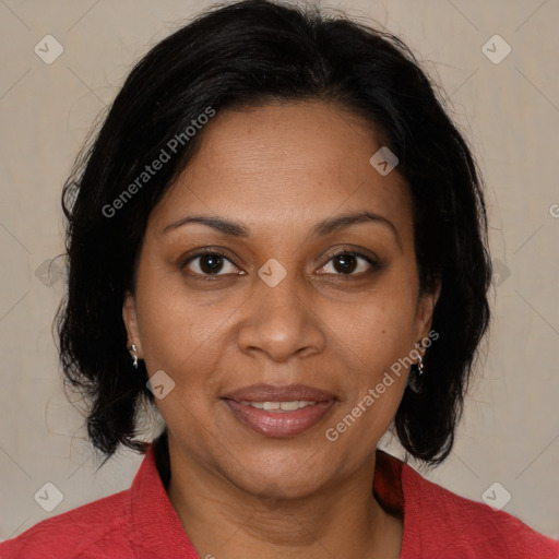 Joyful black adult female with medium  brown hair and brown eyes