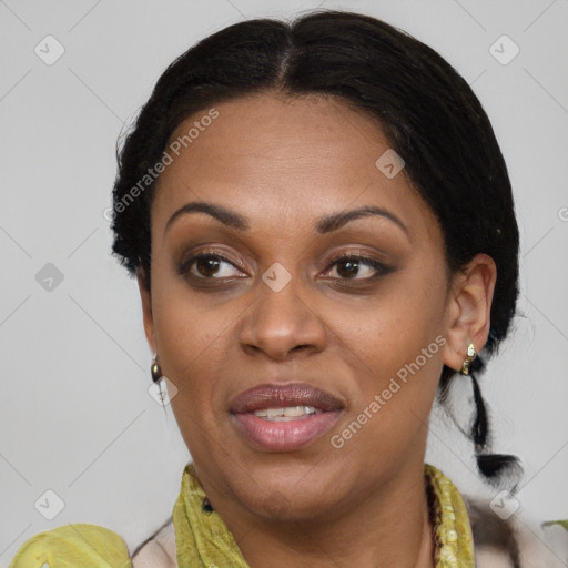 Joyful black adult female with medium  brown hair and brown eyes