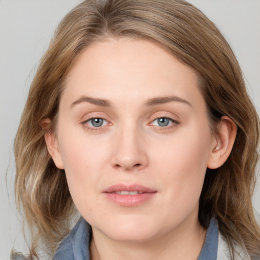 Joyful white young-adult female with medium  brown hair and blue eyes