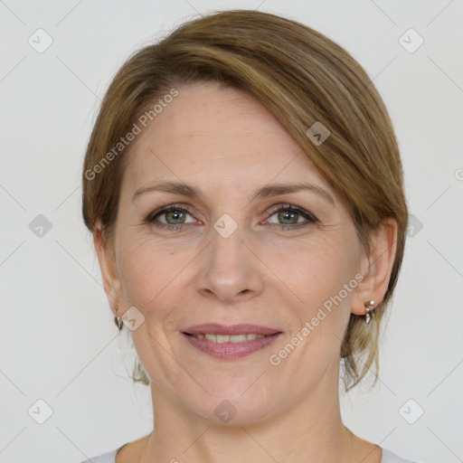 Joyful white adult female with medium  brown hair and grey eyes