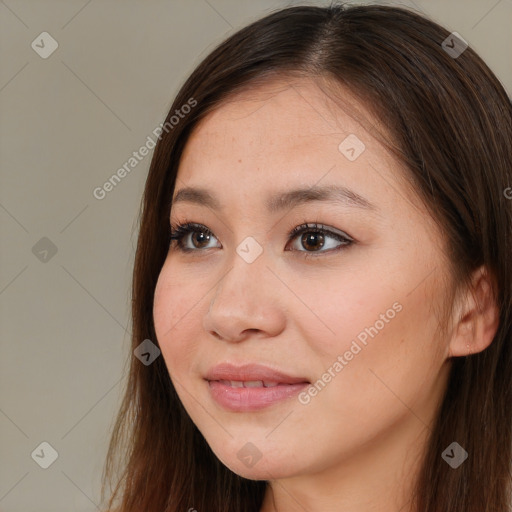 Joyful asian young-adult female with long  brown hair and brown eyes