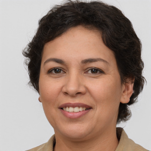 Joyful white adult female with short  brown hair and brown eyes