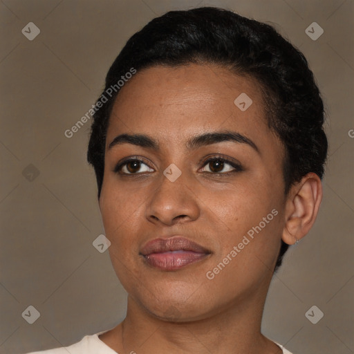 Joyful black young-adult female with short  black hair and brown eyes