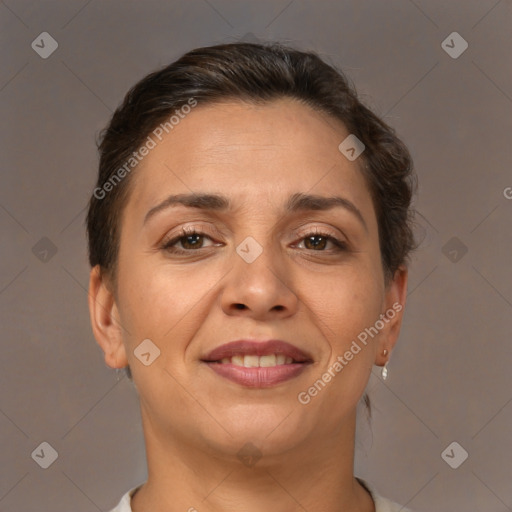 Joyful white adult female with short  brown hair and brown eyes