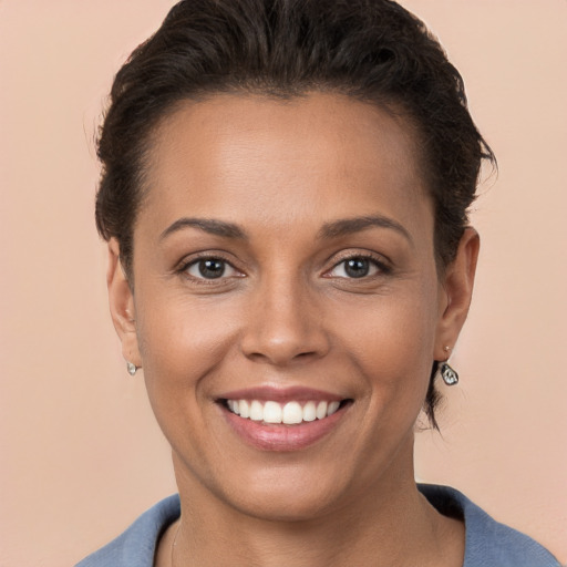 Joyful white young-adult female with short  brown hair and brown eyes