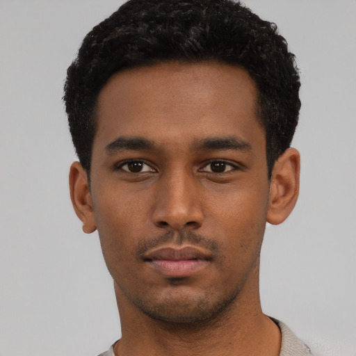 Neutral black young-adult male with short  black hair and brown eyes