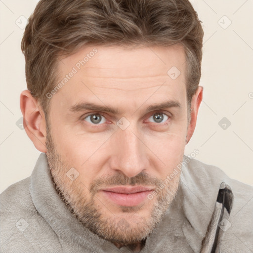 Joyful white adult male with short  brown hair and grey eyes