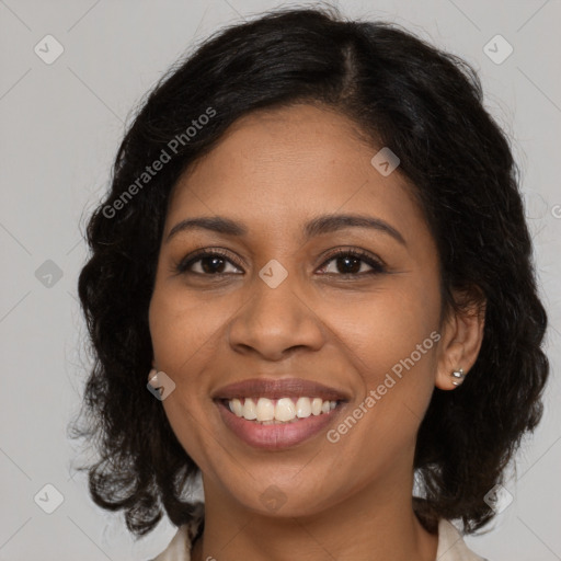 Joyful black young-adult female with medium  brown hair and brown eyes