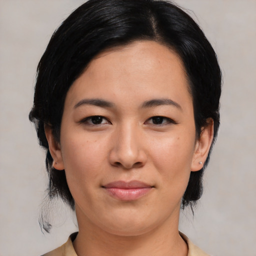 Joyful asian young-adult female with medium  black hair and brown eyes
