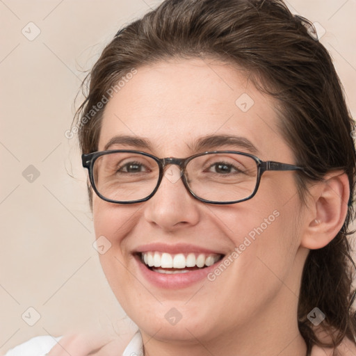 Joyful white young-adult female with medium  brown hair and blue eyes