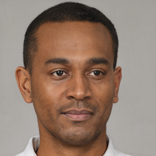 Neutral black young-adult male with short  black hair and brown eyes