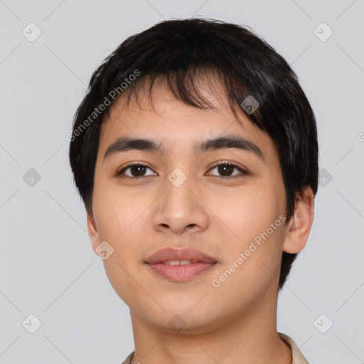 Joyful asian young-adult male with short  black hair and brown eyes