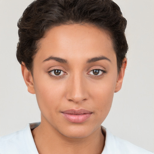 Joyful white young-adult female with short  brown hair and brown eyes