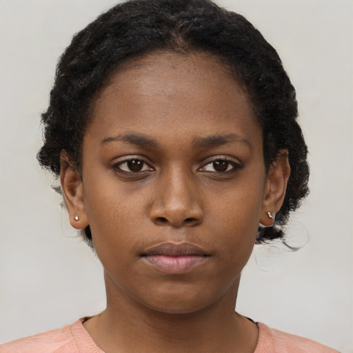 Neutral black young-adult female with short  brown hair and brown eyes