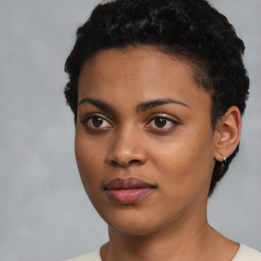Joyful latino young-adult female with short  black hair and brown eyes