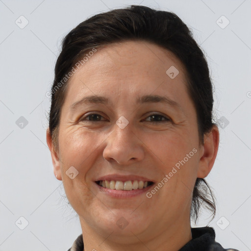 Joyful white adult female with short  brown hair and brown eyes