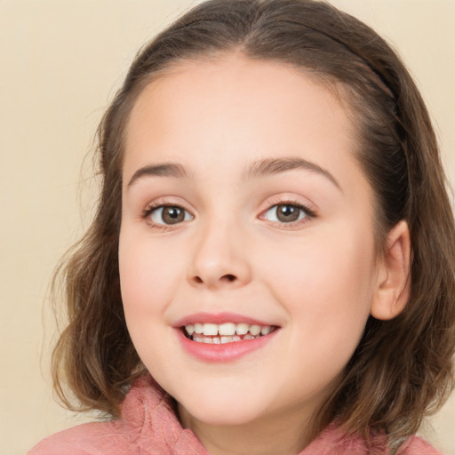 Joyful white child female with medium  brown hair and brown eyes