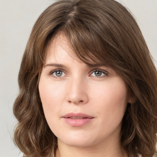 Neutral white young-adult female with medium  brown hair and green eyes