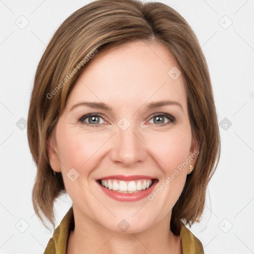 Joyful white young-adult female with medium  brown hair and grey eyes