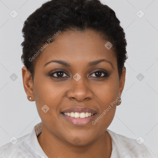 Joyful black young-adult female with short  brown hair and brown eyes