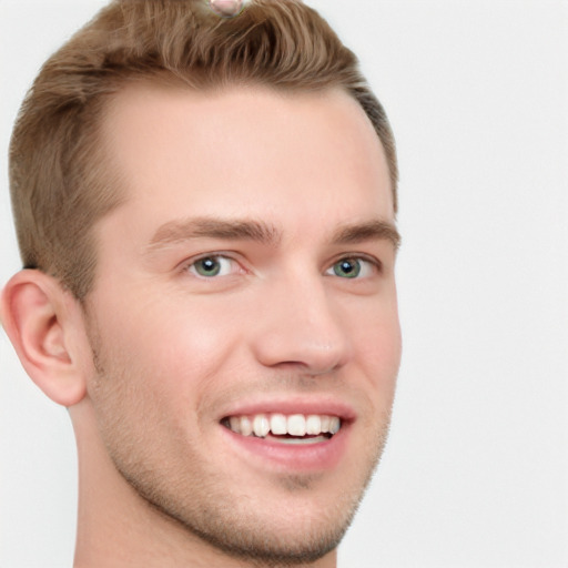 Joyful white young-adult male with short  brown hair and grey eyes