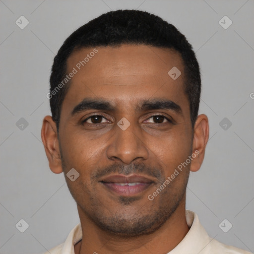 Joyful black young-adult male with short  black hair and brown eyes