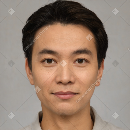 Joyful white young-adult male with short  black hair and brown eyes