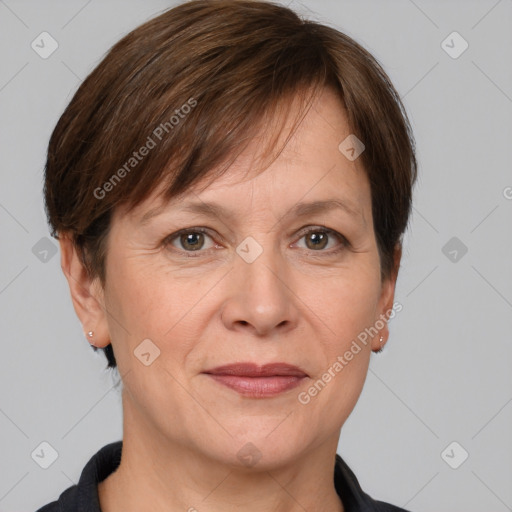 Joyful white adult female with short  brown hair and grey eyes