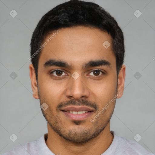 Joyful latino young-adult male with short  black hair and brown eyes