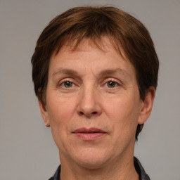 Joyful white adult male with short  brown hair and grey eyes