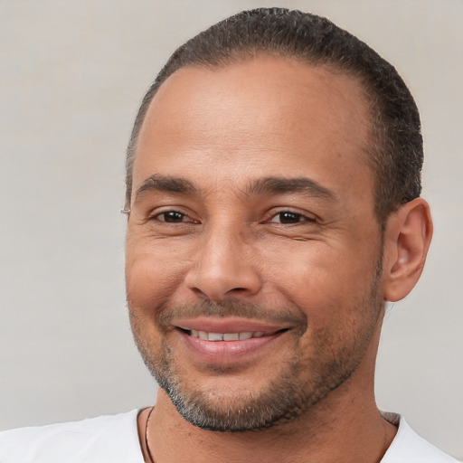 Joyful white adult male with short  brown hair and brown eyes