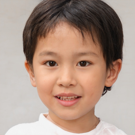 Joyful white child female with short  brown hair and brown eyes