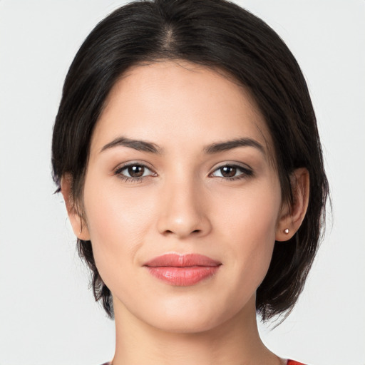 Joyful white young-adult female with medium  black hair and brown eyes