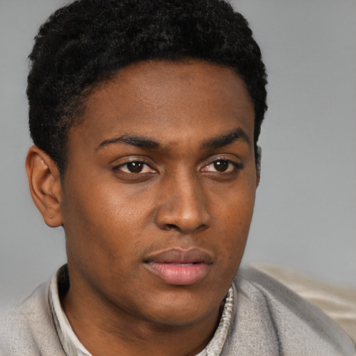 Neutral black young-adult male with short  brown hair and brown eyes