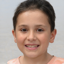 Joyful white child female with short  brown hair and brown eyes