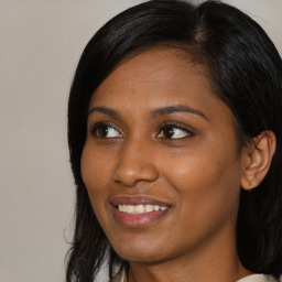 Joyful asian young-adult female with medium  black hair and brown eyes