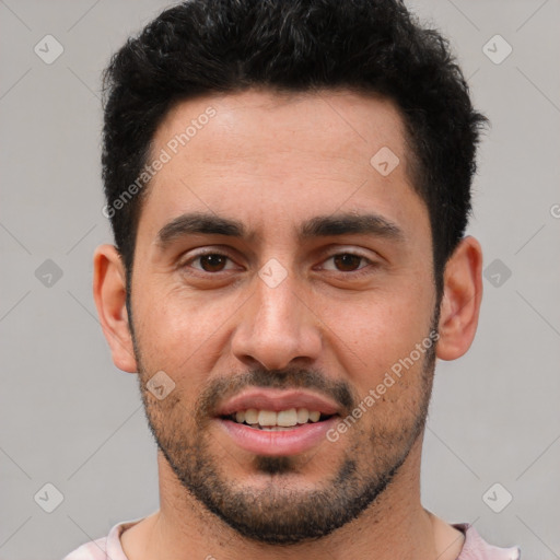 Joyful white young-adult male with short  black hair and brown eyes