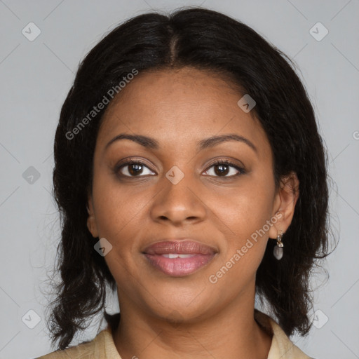 Joyful black young-adult female with medium  brown hair and brown eyes