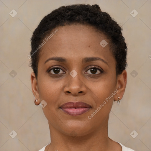 Joyful black young-adult female with short  brown hair and brown eyes