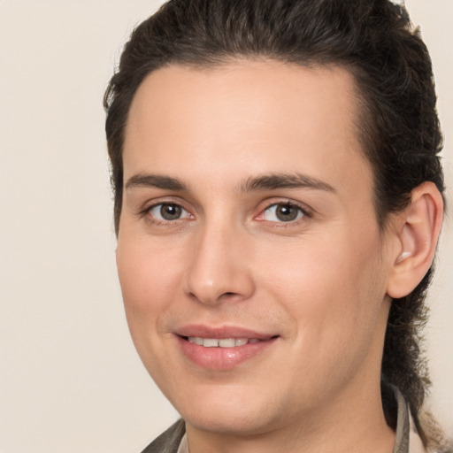 Joyful white young-adult male with medium  brown hair and brown eyes